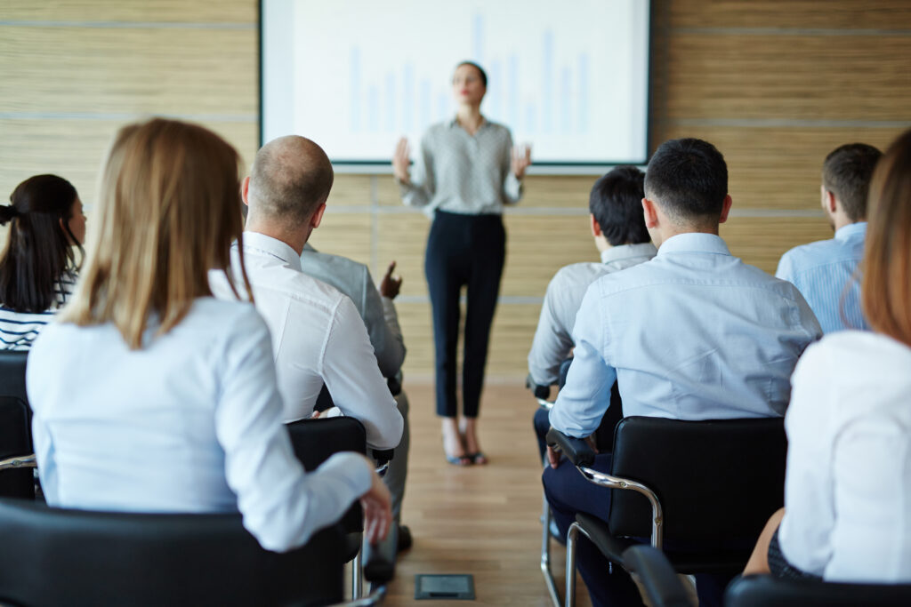 Business woman giving a training to employees